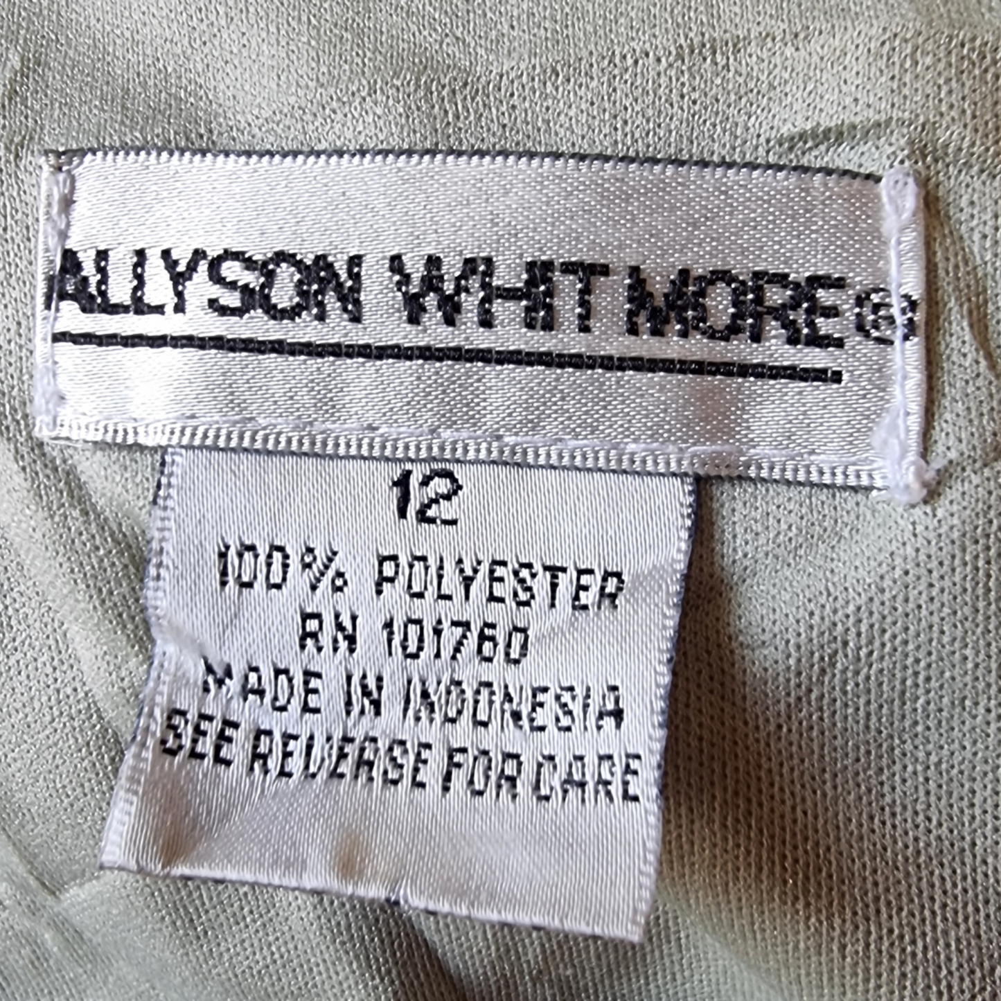 Label with 'ALLYSON WHITMORE' branding on a garment.