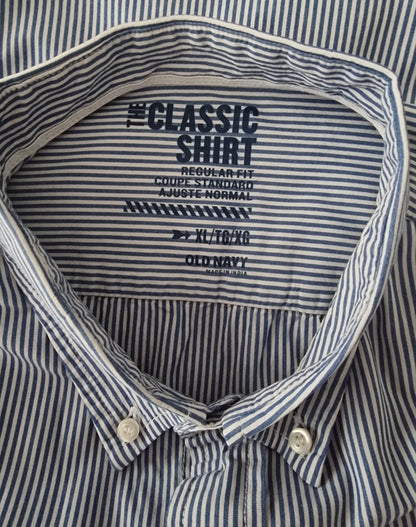 Close-up of a striped shirt with 'Classic Shirt' label on the collar.