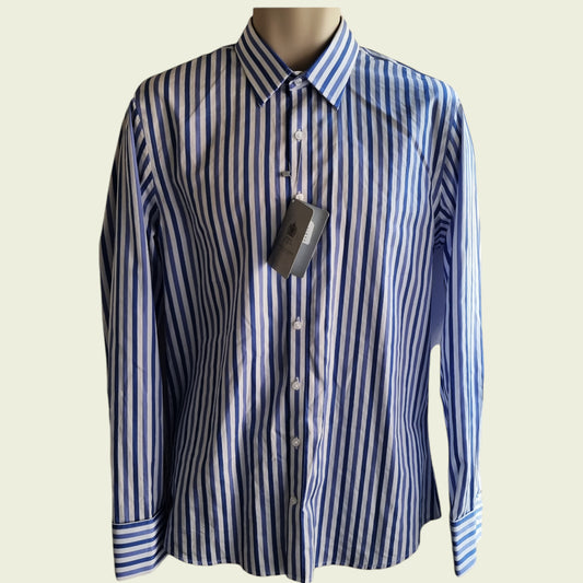 Blue and white striped shirt on a mannequin with a visible tag against a beige background