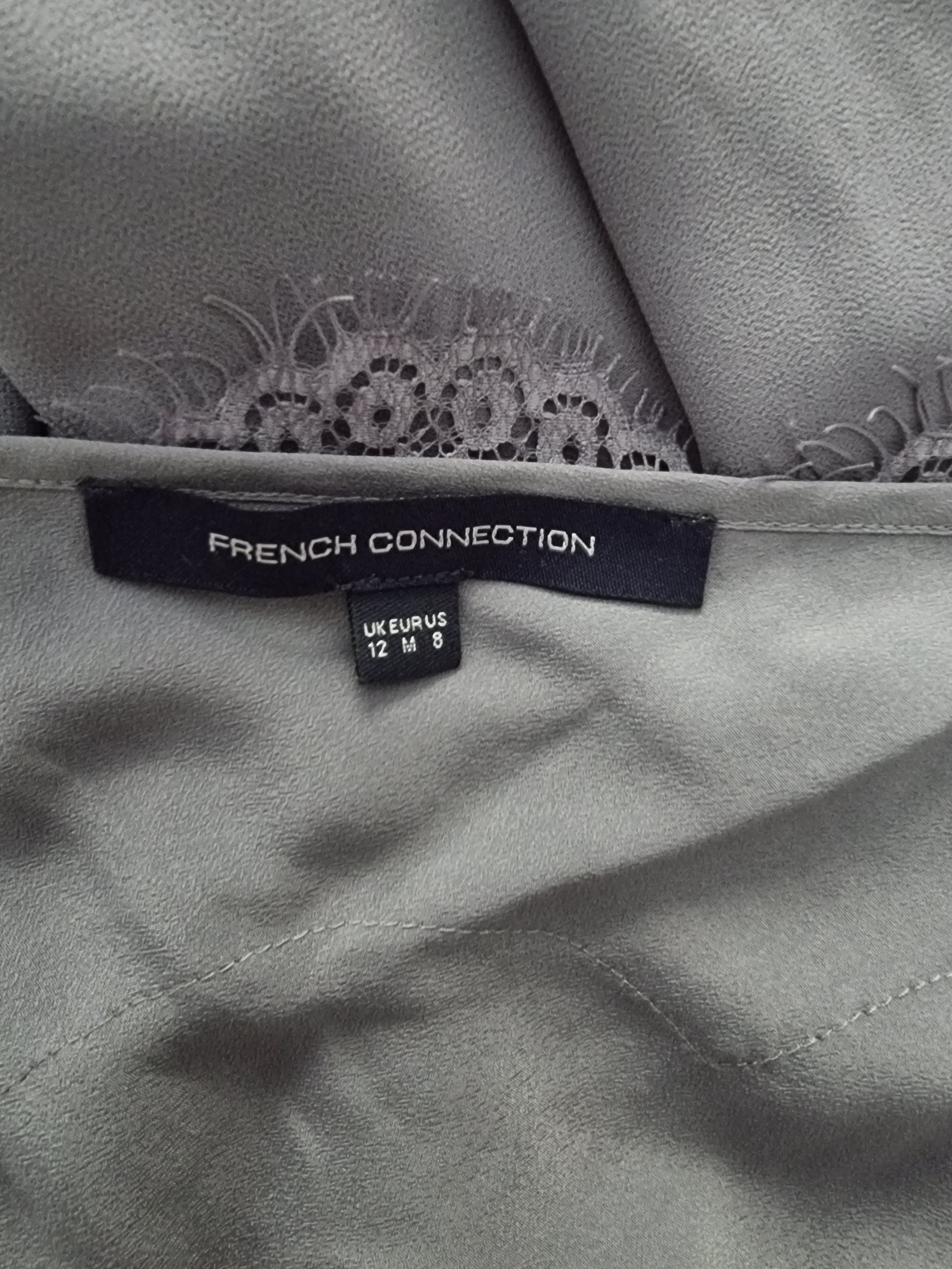 Gray fabric with lace trim and a 'French Connection' label.