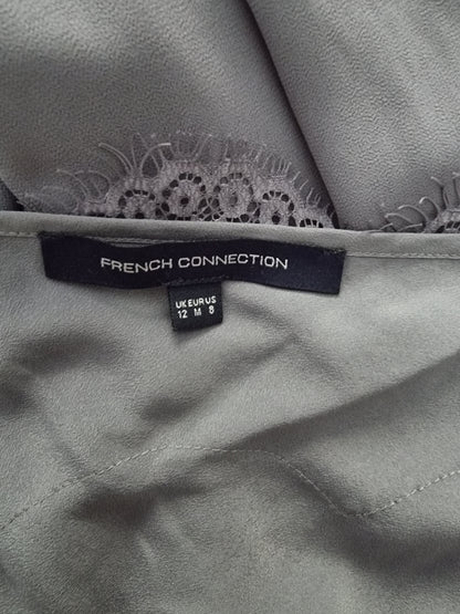 Gray fabric with lace trim and a 'French Connection' label.