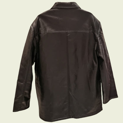 Black leather jacket on a beige background