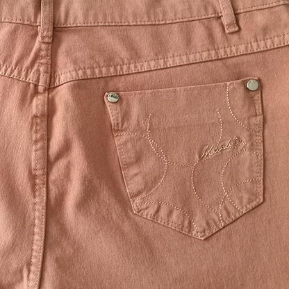 Close-up of a brown pocket on a garment with 'Mackintosh' branding.