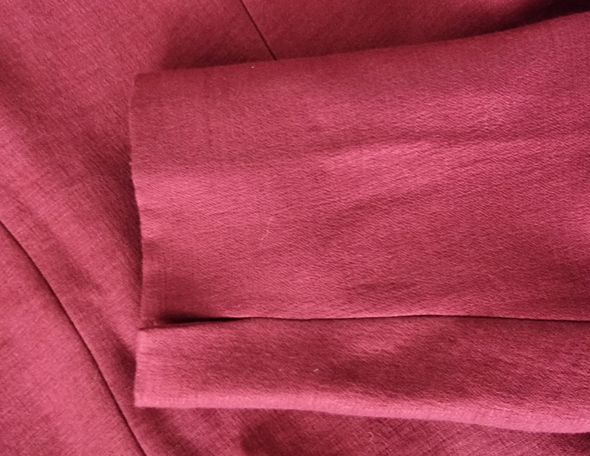 Close-up of red fabric with a textured pattern