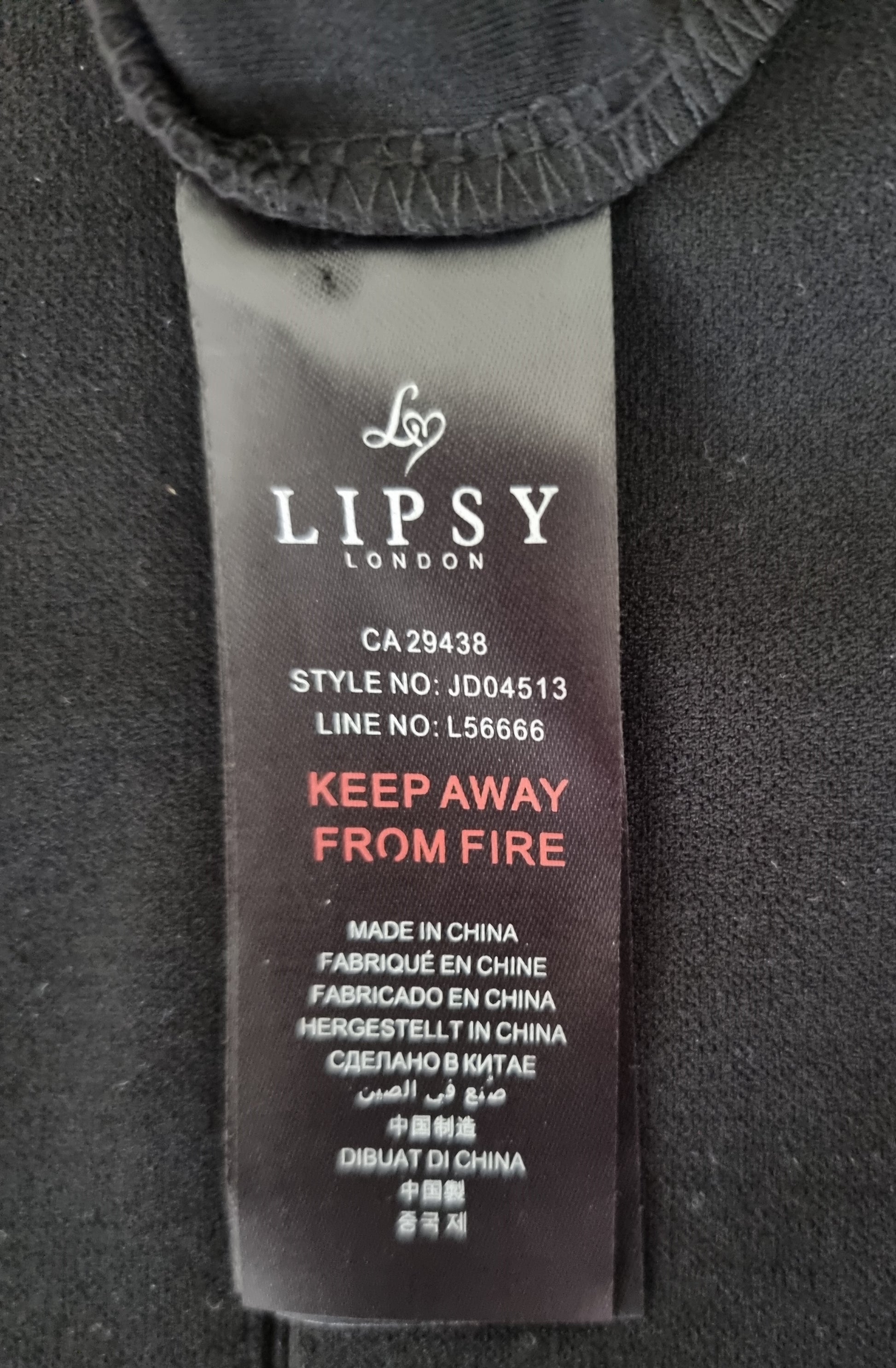 Lipsy London label on a garment with fire safety warning text.