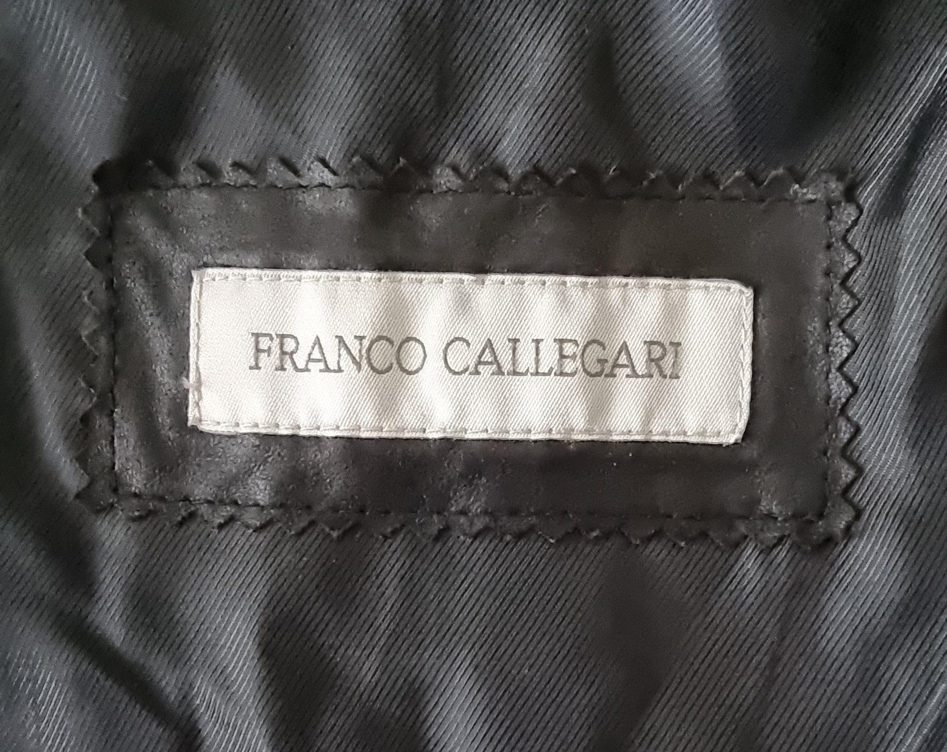 Franco Callegari label on a textured fabric background