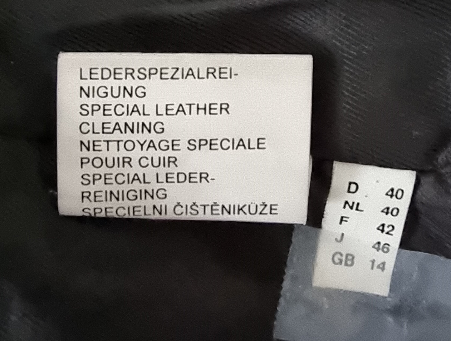 Label for special leather cleaning on a black surface