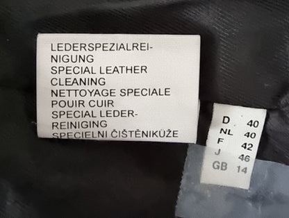 Label for special leather cleaning on a black surface