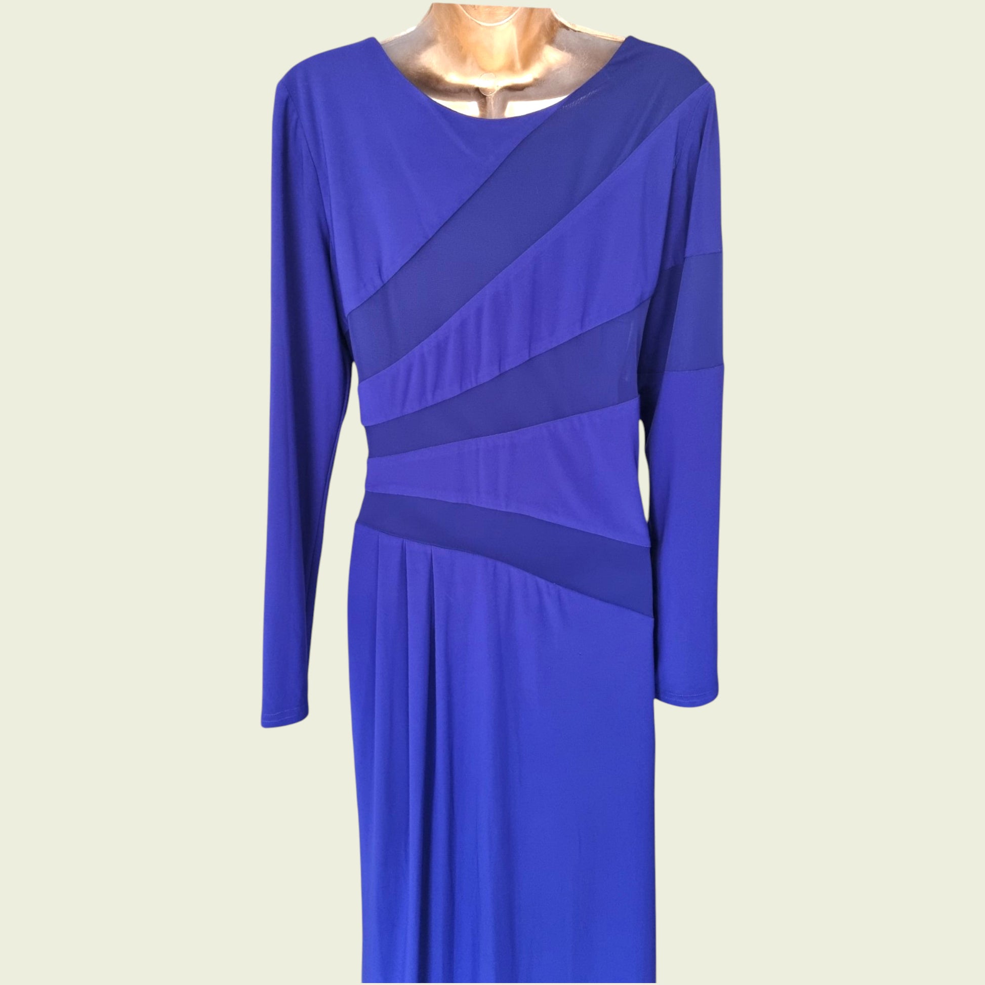 Blue dress with long sleeves on a beige background