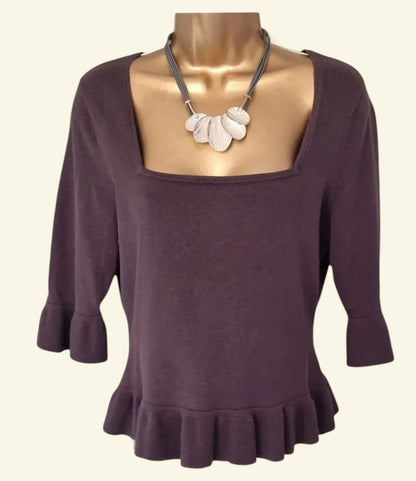 Model wearing Fenn Wright Manson Taupe Top on a beige background