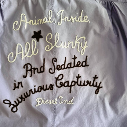 Text on a shirt with a star symbol, featuring the brand 'Diesel'.