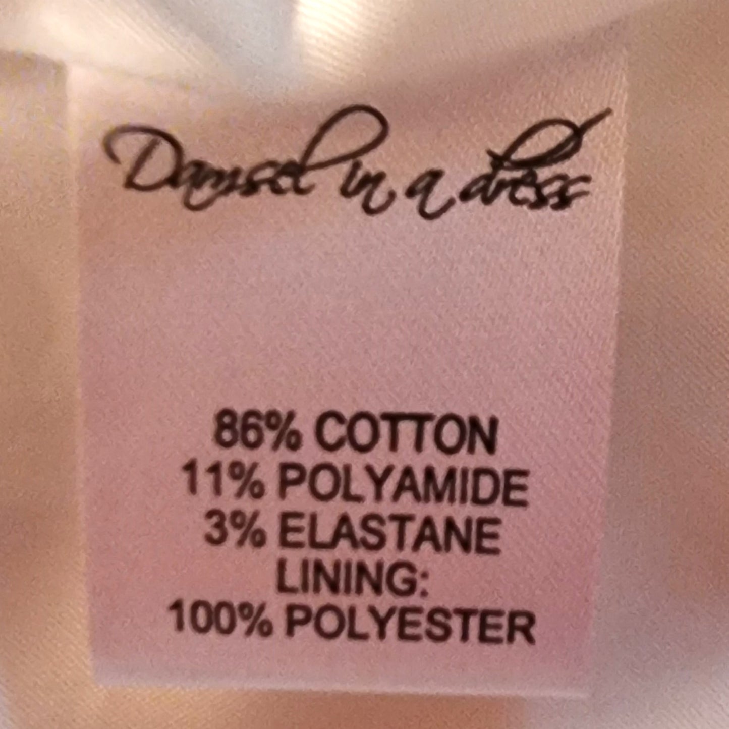 Fabric label with material composition details on a white background
