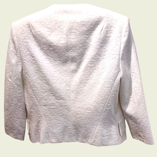 White textured blazer on a beige background