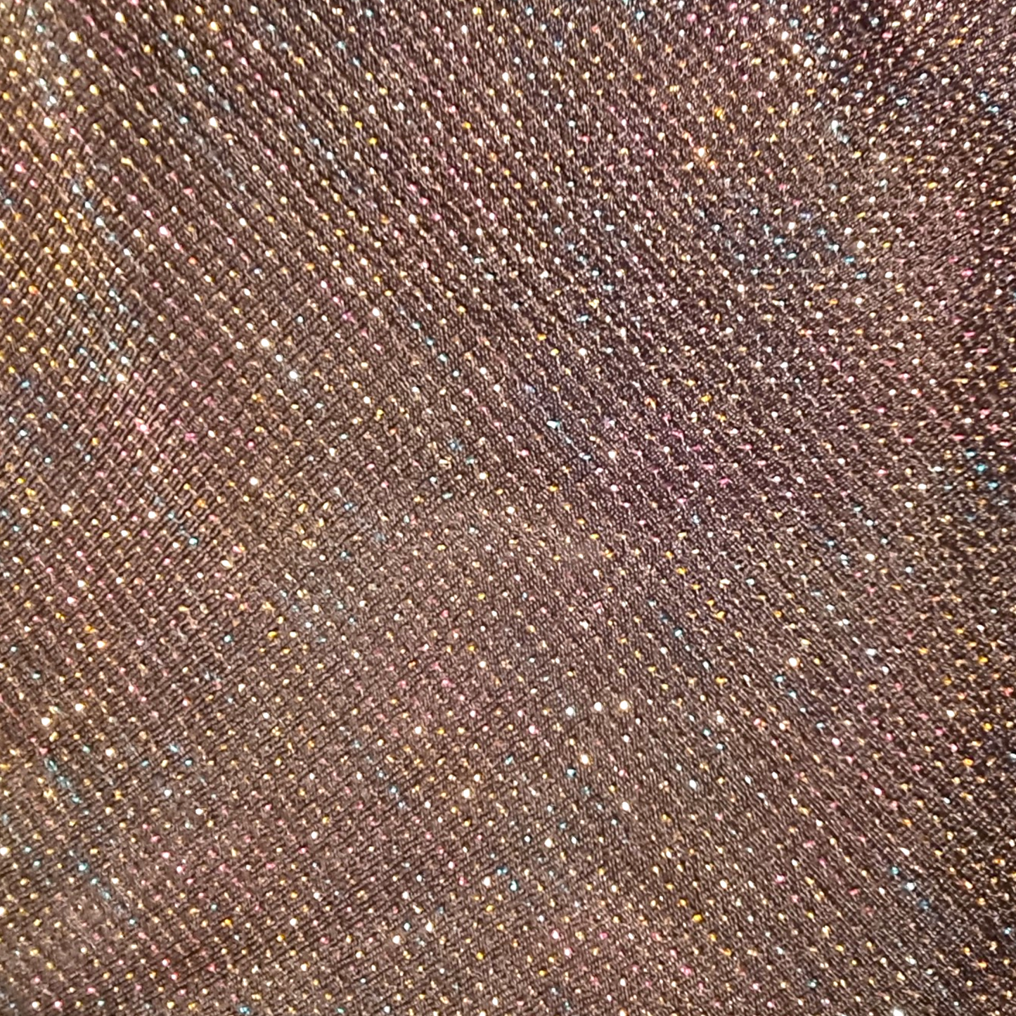 Close-up of a textured black fabric with a subtle pattern