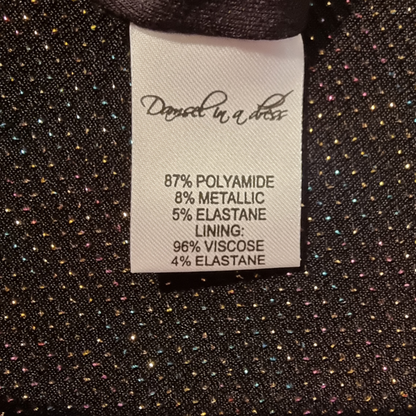 Clothing label with fabric composition details on a textured fabric background