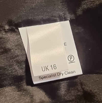 Fabric care label on a textured surface