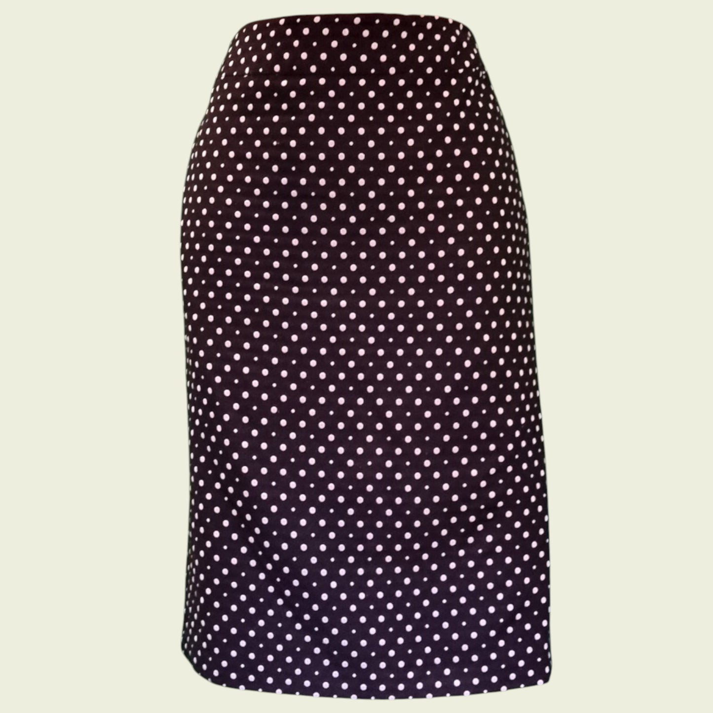 Polka dot skirt on a beige background