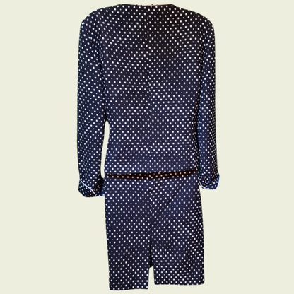 Black suit with white polka dots on a beige background