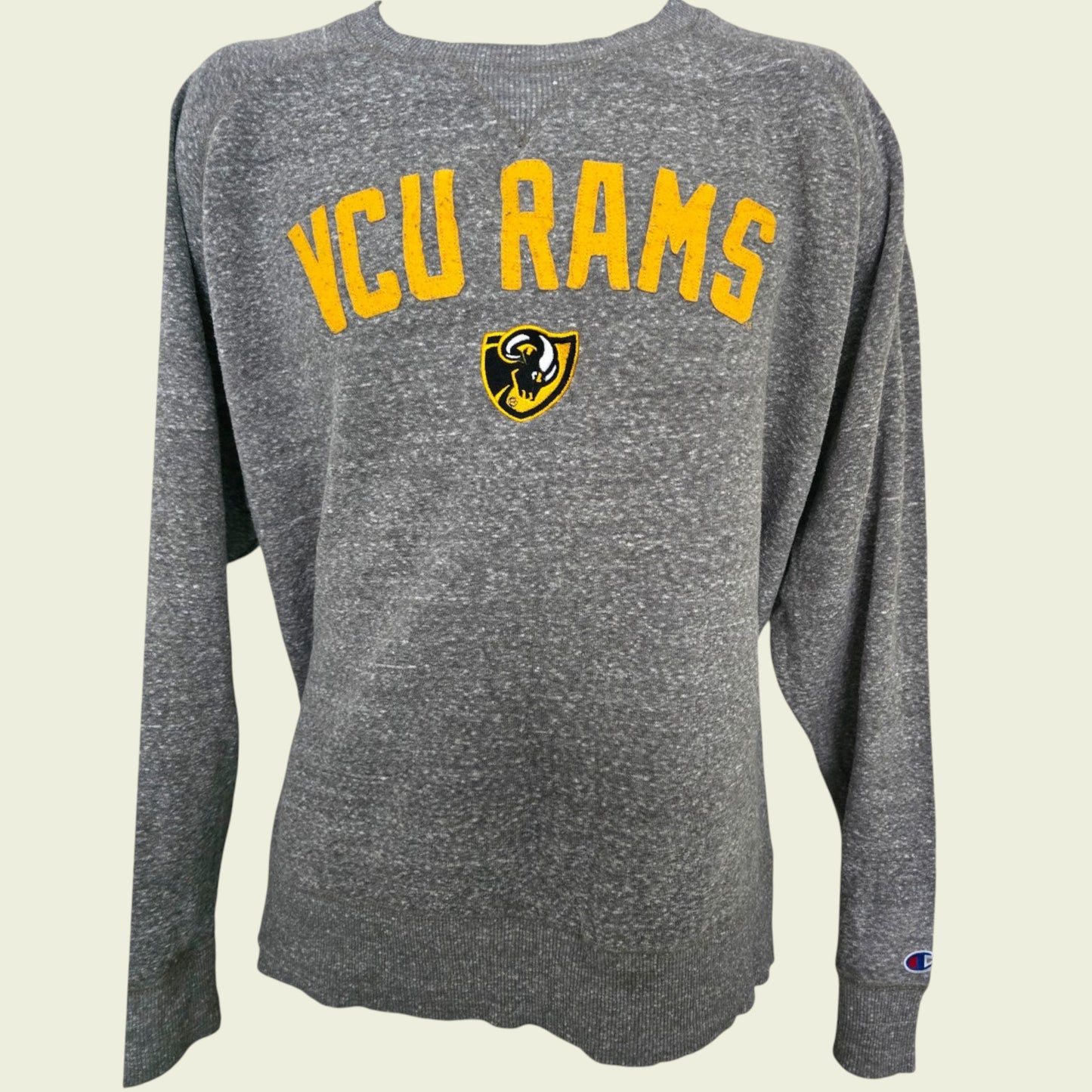 Gray long-sleeve shirt with 'VCU Rams' text and logo on a beige background