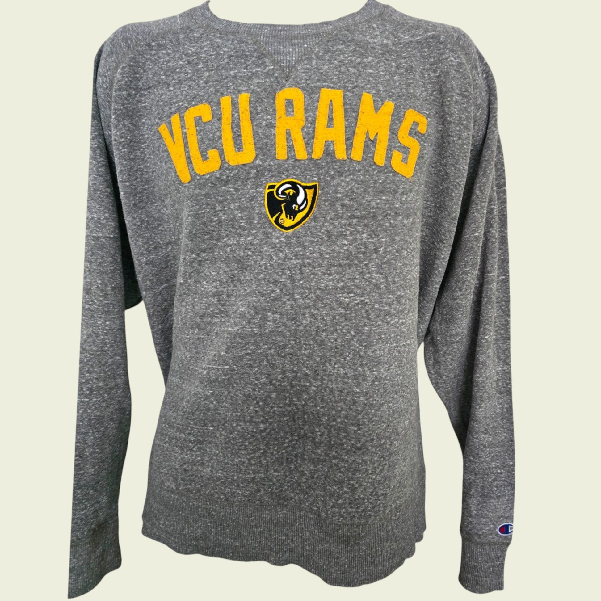 Gray long-sleeve shirt with 'VCU Rams' text and logo on a beige background