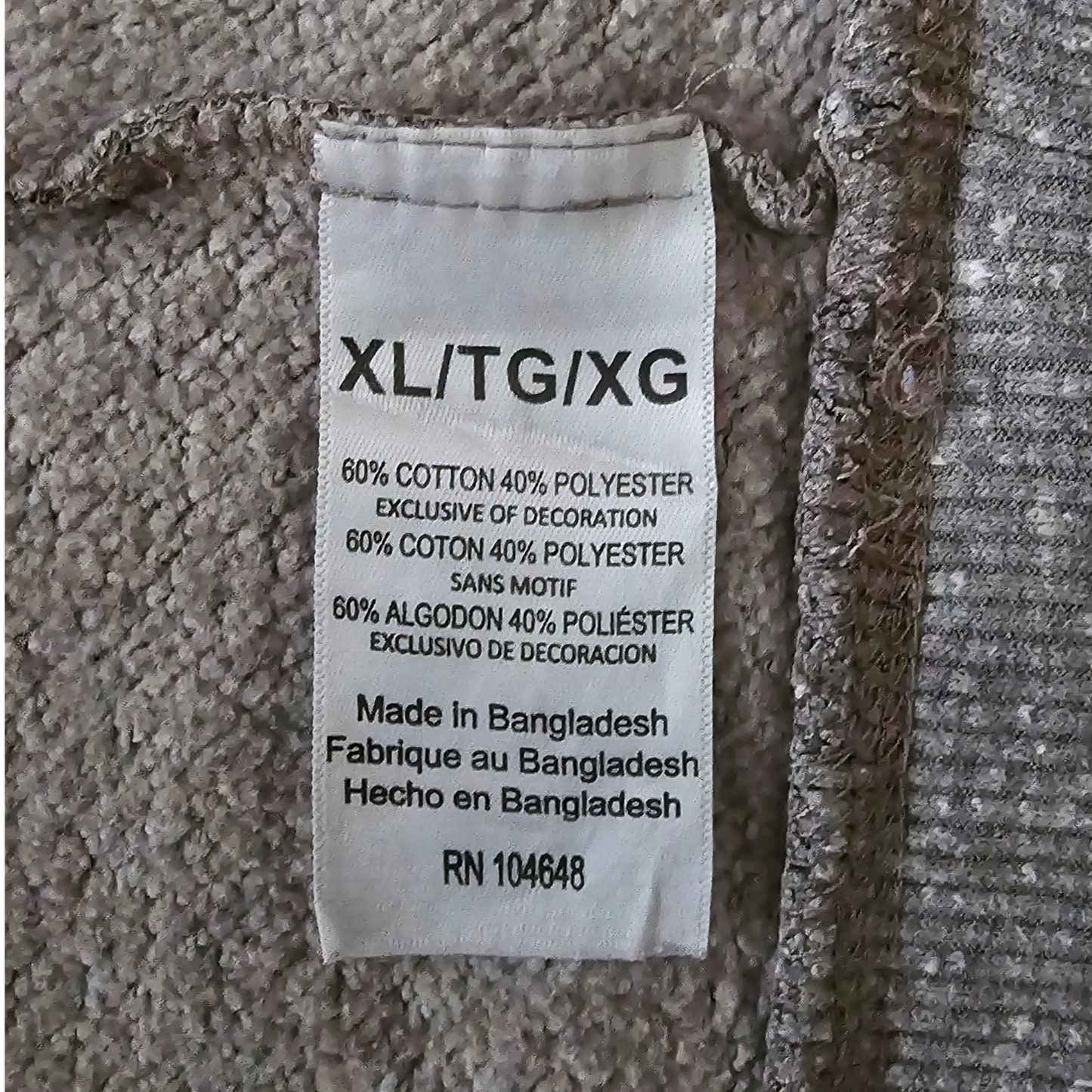 Fabric tag with text on a textured fabric background