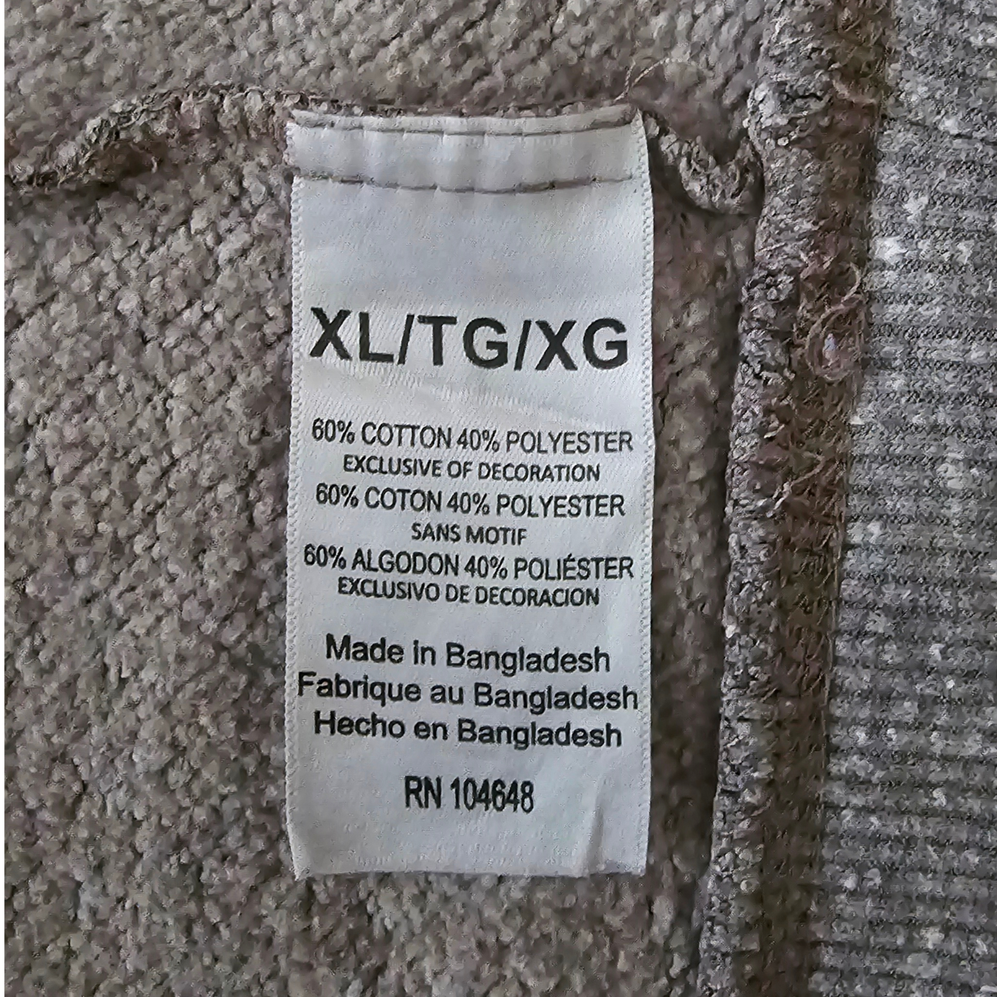 Fabric tag with text on a textured fabric background