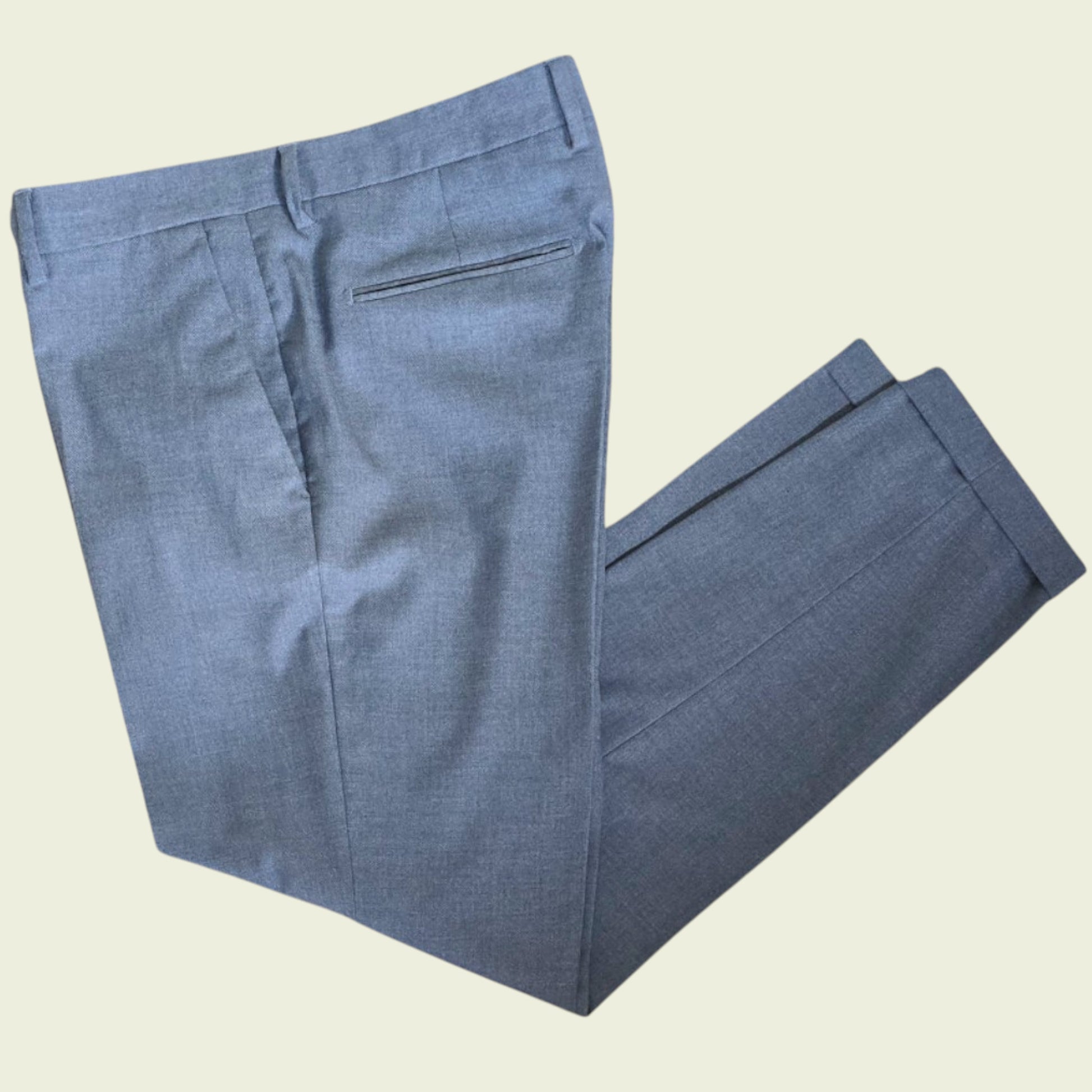 Grey pants on a beige background