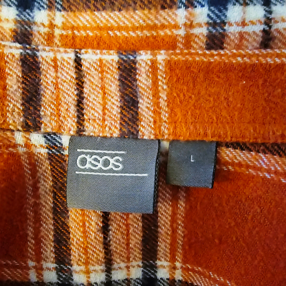ASOS label on a plaid fabric background