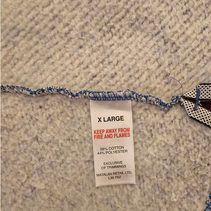 Textile product with a label on a textured fabric background