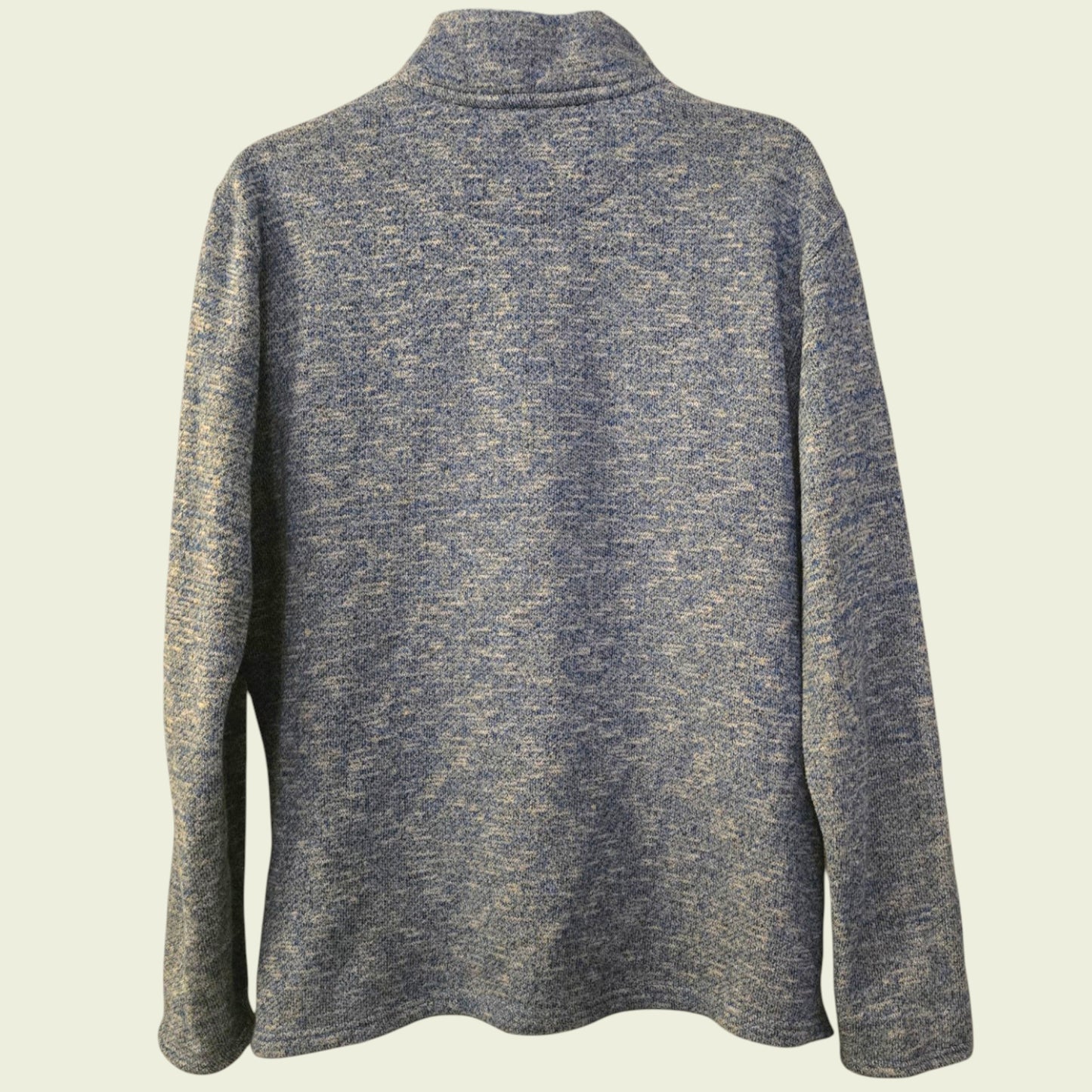 Blue knitted sweater on a beige background