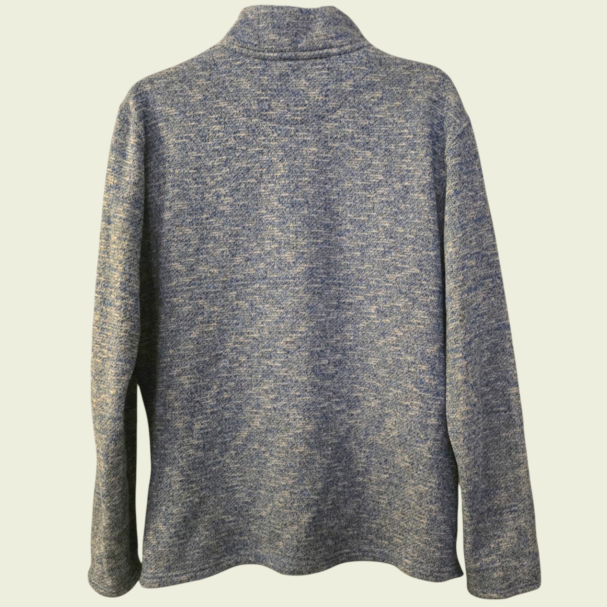 Blue knitted sweater on a beige background