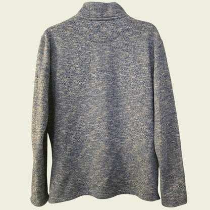 Blue knitted sweater on a beige background