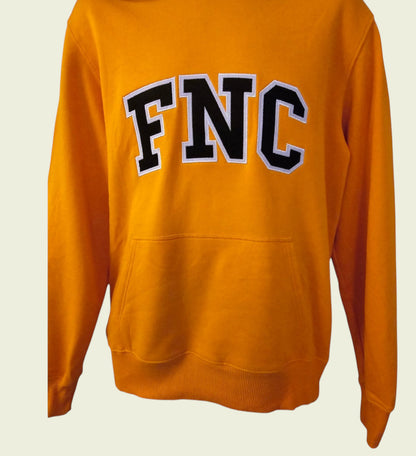 Orange sweatshirt with 'FNC' text on a beige background