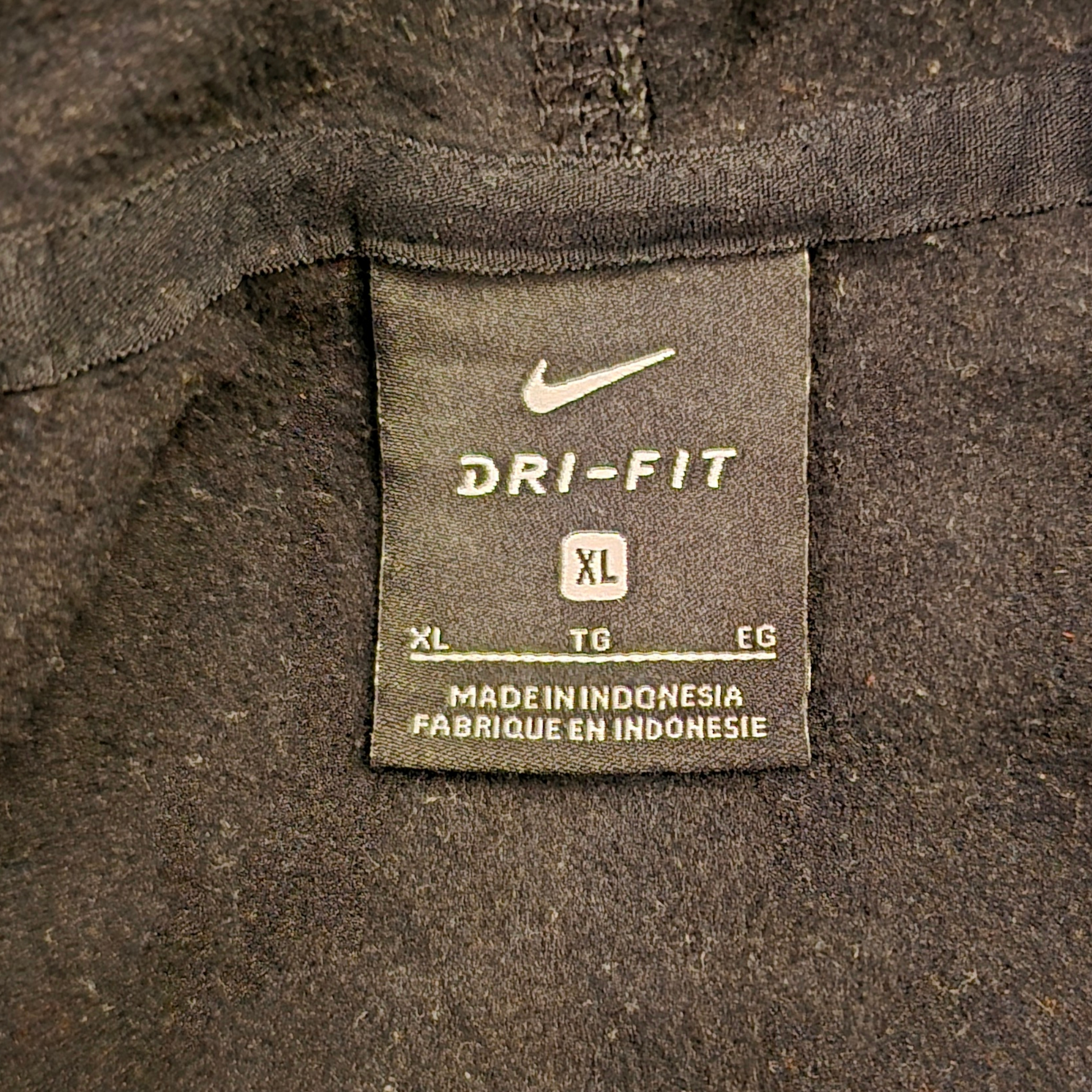 Dri-Fit label on a dark fabric background