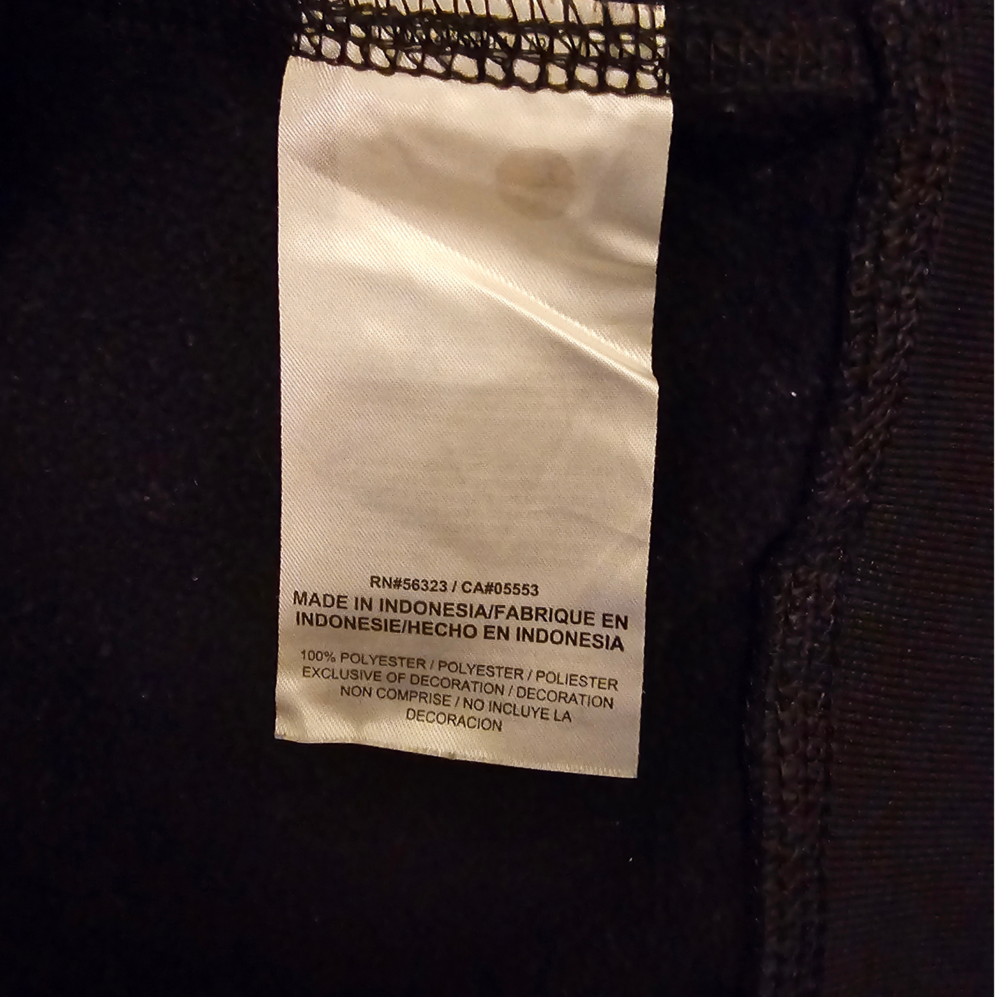 Fabric tag on a dark textured fabric background