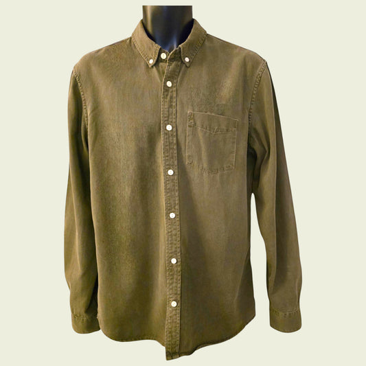 Green button-up shirt on a mannequin against a beige background