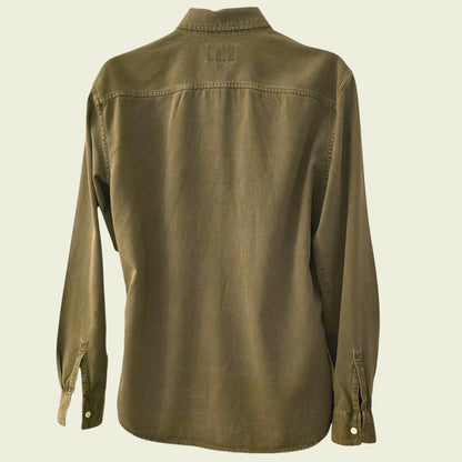 Green shirt on a beige background