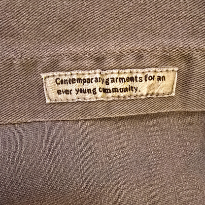 Text label on a brown fabric background
