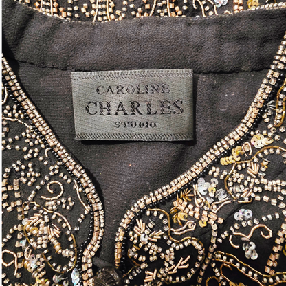 Embroidered garment with 'Caroline Charles Studio' label