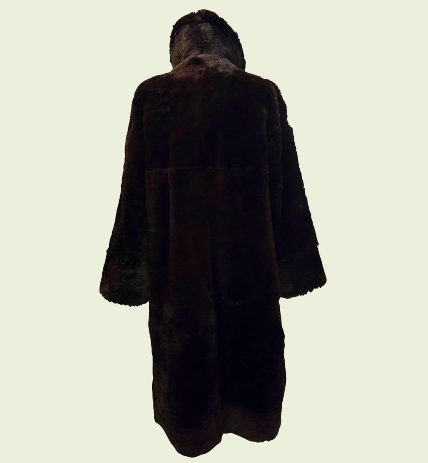 Brown fur coat on a light beige background