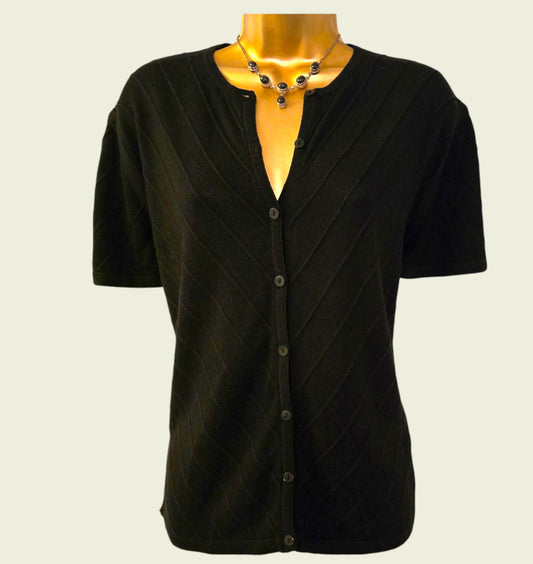 Black short-sleeve cardigan on a mannequin with a plain background