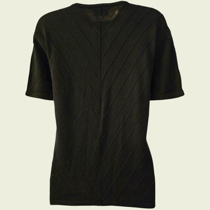 Black textured cardigan on a beige background