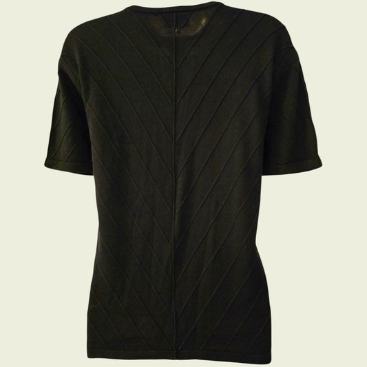 Black textured cardigan on a beige background