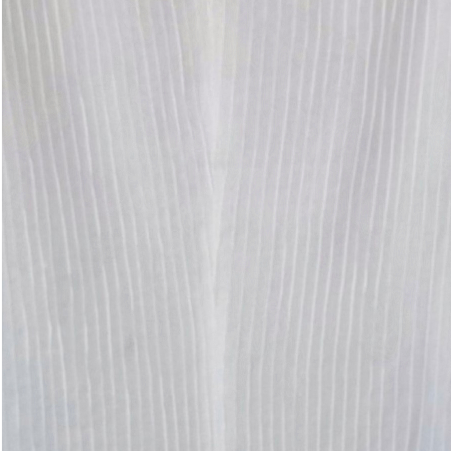 Close-up of a textured white fabric surface