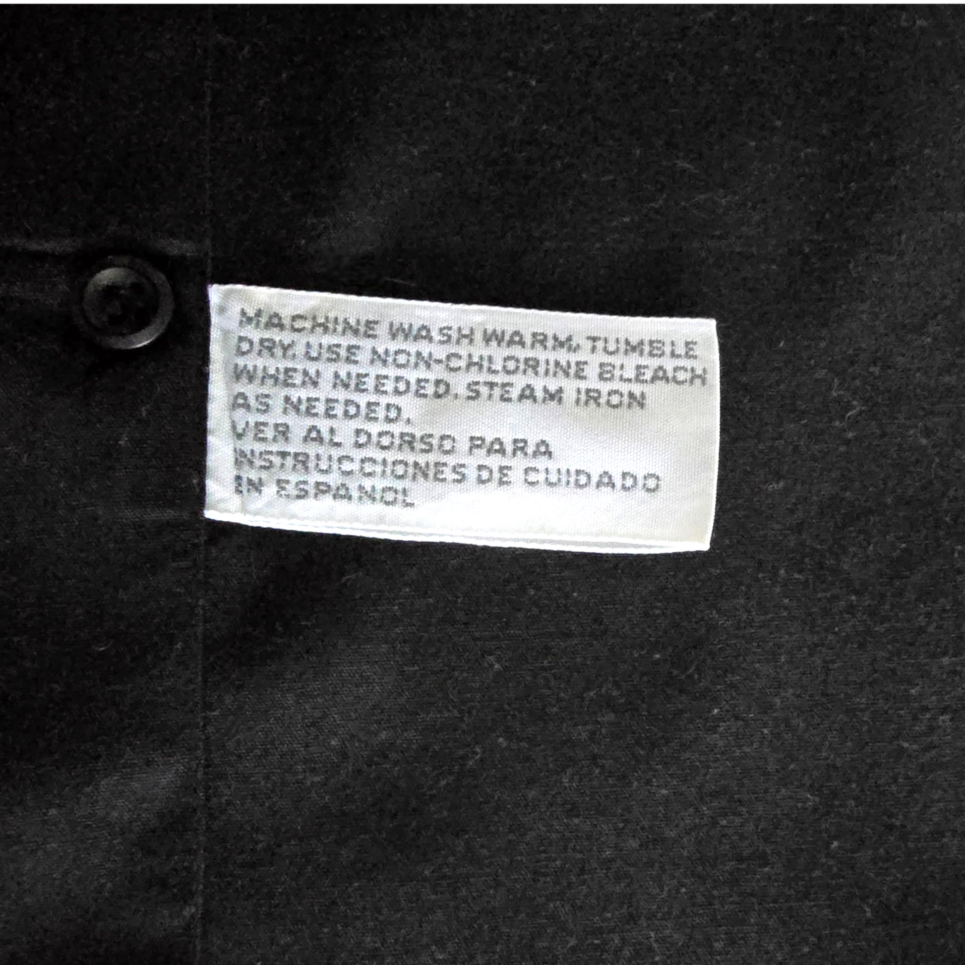 Clothing label on a dark fabric background