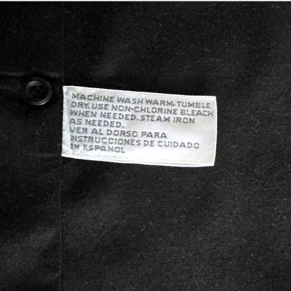 Clothing label on a dark fabric background