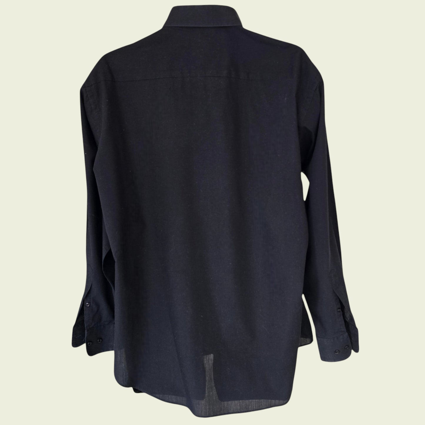 Black shirt on a beige background