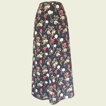 Black floral skirt on beige background