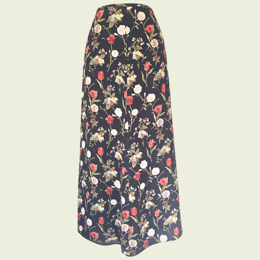 Black floral skirt on beige background