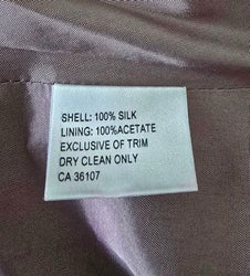 Fabric tag on a piece of fabric with text details
